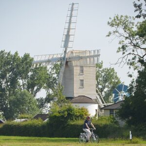 Cycling by Saxtead Green post mill Suffolk