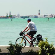cyclist by the water