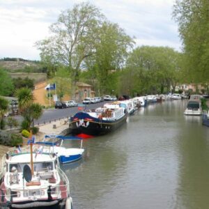 France Canal du Midi boats by cycle-towpath near Capestang.